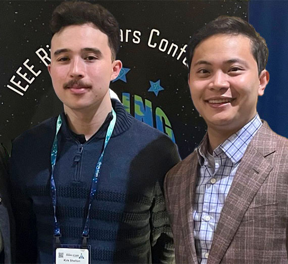 Four students show Order of the Engineer rings through the ceremony ring